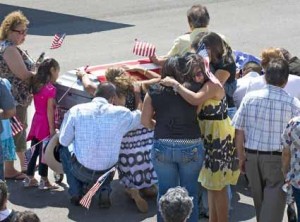Family members of Alejandro Granado meet his casket at the East Texas Regional Airport.